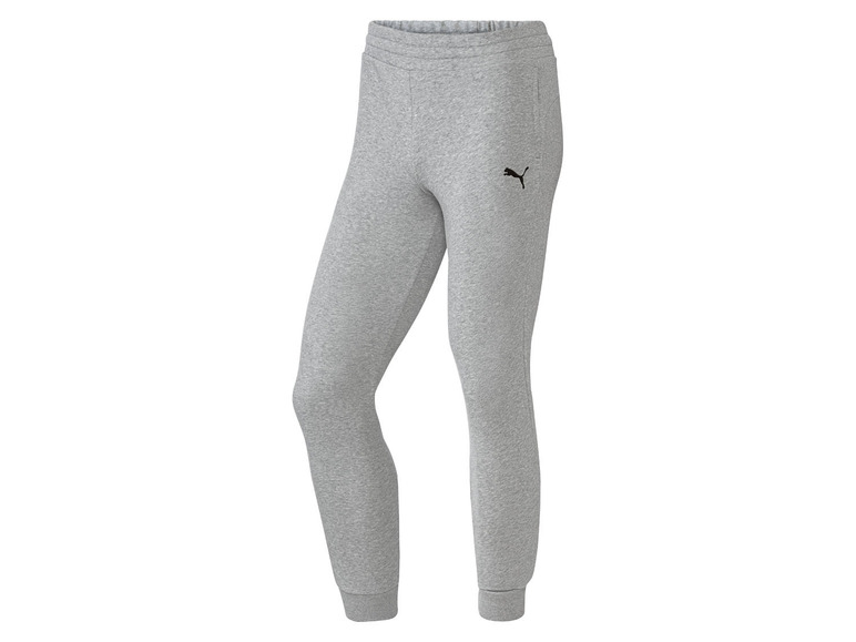 Šedé tepláky Puma s logem.