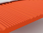 Detailní pohled na oranžový matrace s reliéfním vzorem.