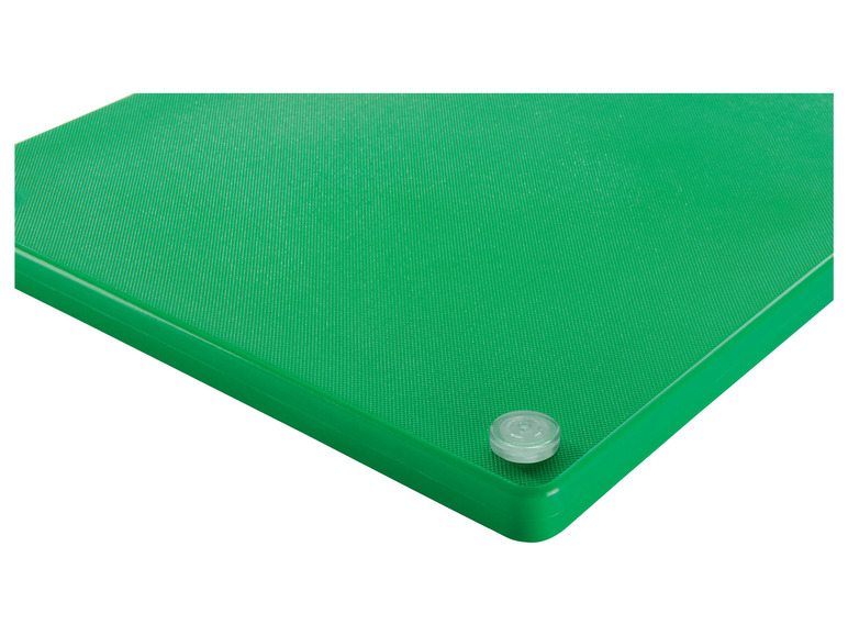 Zelená krájecí deska s protiskluzovými nožičkami.