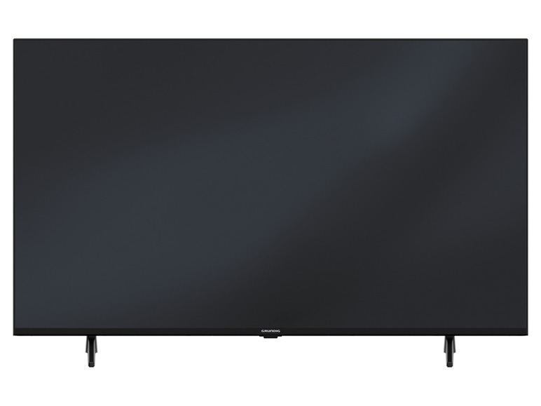 Černá televize Grundig se dvěma nohama.