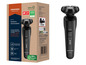 Černá rotační holicí stroj Grundig Rotations-Herrenrasierer s nápisem 'Turbo' a 'wet&dry'.