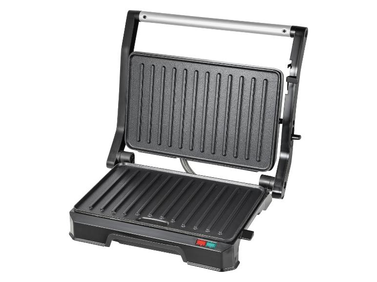 Elektrický gril a panini gril: elegantní černý přístroj pro snadné grilování.