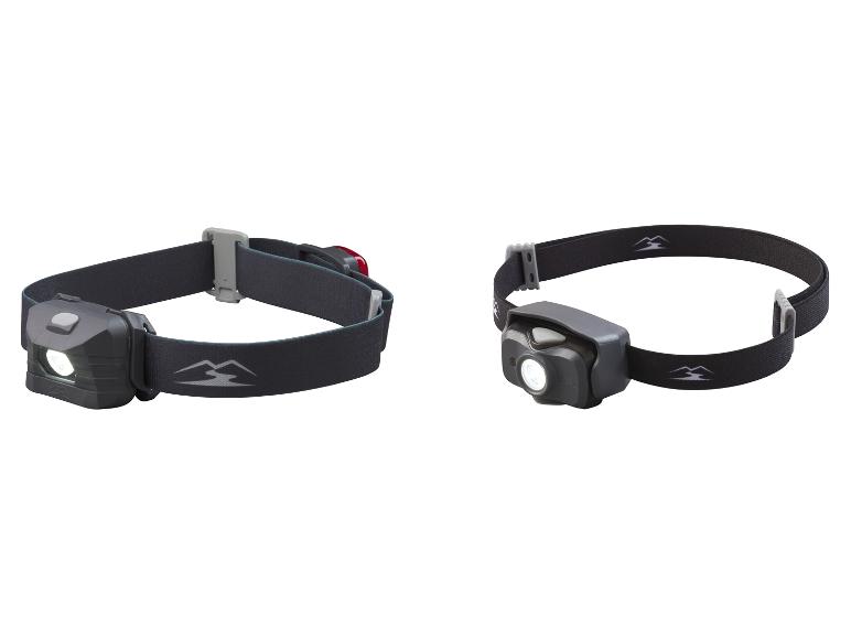 Dvě čelovky Black Diamond s červeným LED světlem.