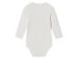 Bílé body pro miminko s dlouhým rukávem.