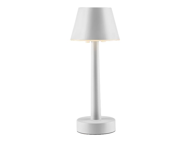 Bílá stolní lampa s kulatým stínidlem.