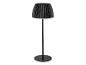 Černá stojací lampa s plisovaným stínidlem a kulatou základnou.