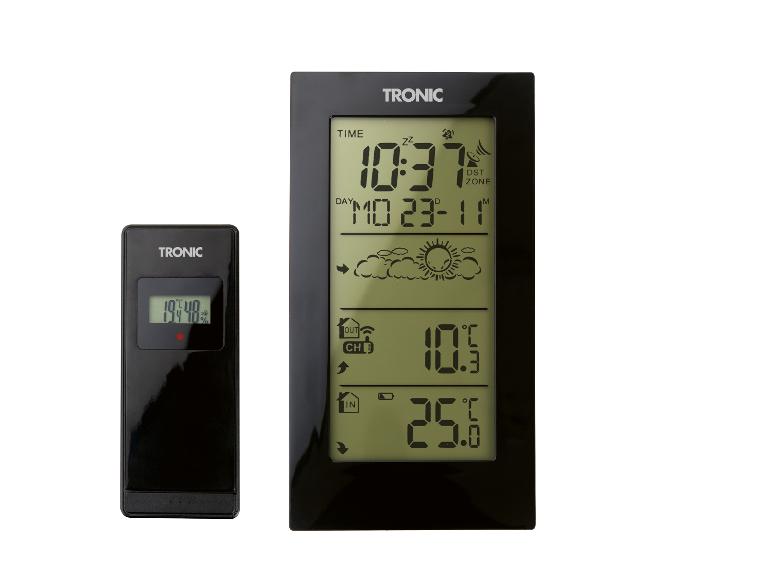 Digitální meteostanice s venkovním senzorem zobrazující čas, datum a vnitřní/venkovní teplotu.
