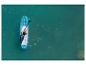 Osoba pádluje na paddleboardu Hydro-Force po tyrkysové vodě.