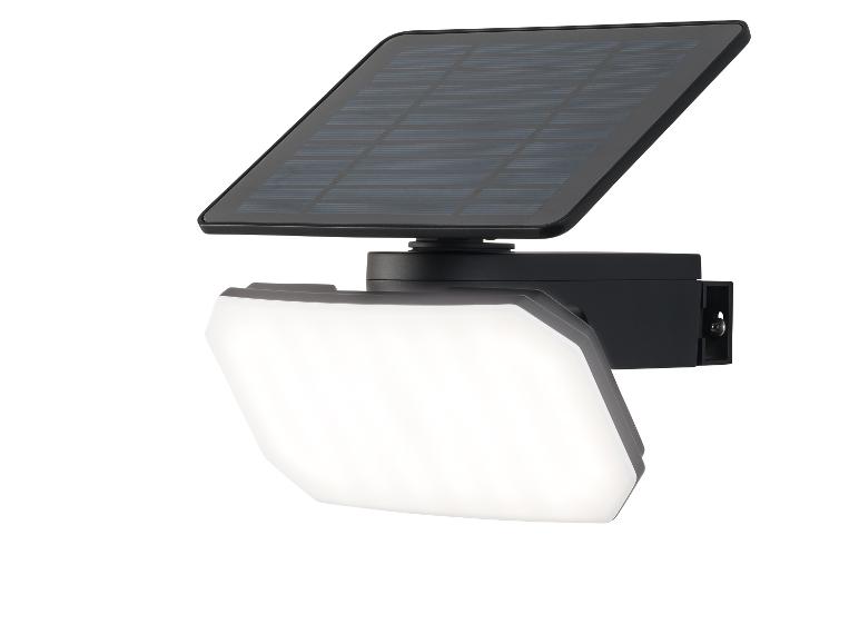 Černý LED solární reflektor s integrovaným solárním panelem.