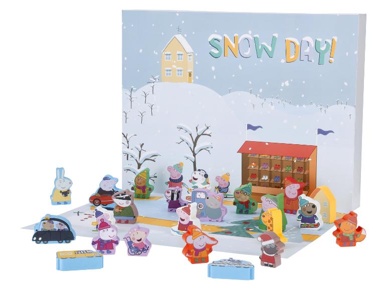 Zimní hrací sada Peppa Pig s figurkami a pozadím zasněženého dne.