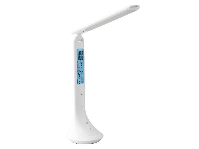 Bílá LED stolní lampa s integrovanými hodinami a teploměrem.