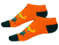 Dva páry krátkých oranžových ponožek s motivem dinosaurů.