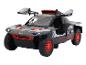 Černý a červený model Audi e-tron do terénu.
