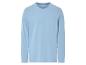 Světle modré tričko s dlouhým rukávem a kapsou na hrudi.