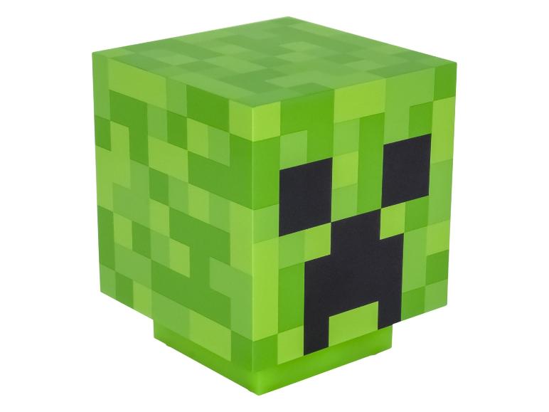 Zelená pixelovaná kostka s černými rysy obličeje, připomínající postavu z videohry.