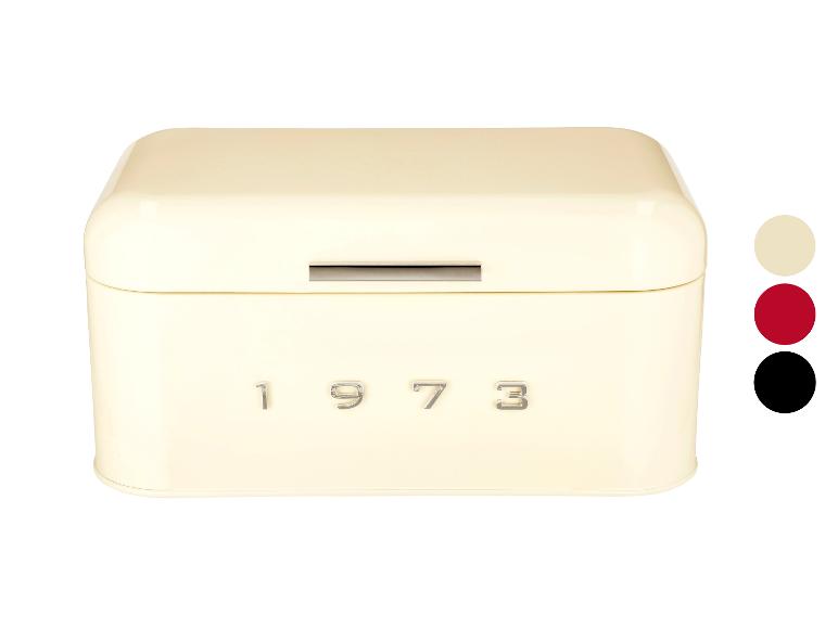 Krémová kovová krabička na chleba s nápisem '1973'.