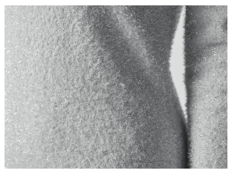 Detail stříbrné třpytivé látky