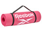 Růžová jógová podložka Reebok s popruhem na nošení.
