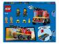 LEGO City Hasičské auto (60463) se dvěma minifigurkami, hasičskými doplňky a návodem na stavbu.