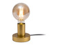 Zlatá stolní lampa s kulatým skleněným stínidlem.