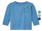Světle modré dětské tričko s dlouhým rukávem s obrázkem dinosaura na kapse.