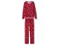 Červené pyžamo s potiskem bílých sněhových vloček a mašlí