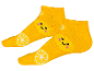 Žluté ponožky s motivem usměvavých citronů.
