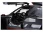 Černý model Audi s otevřenými dveřmi, pohled do interiéru.