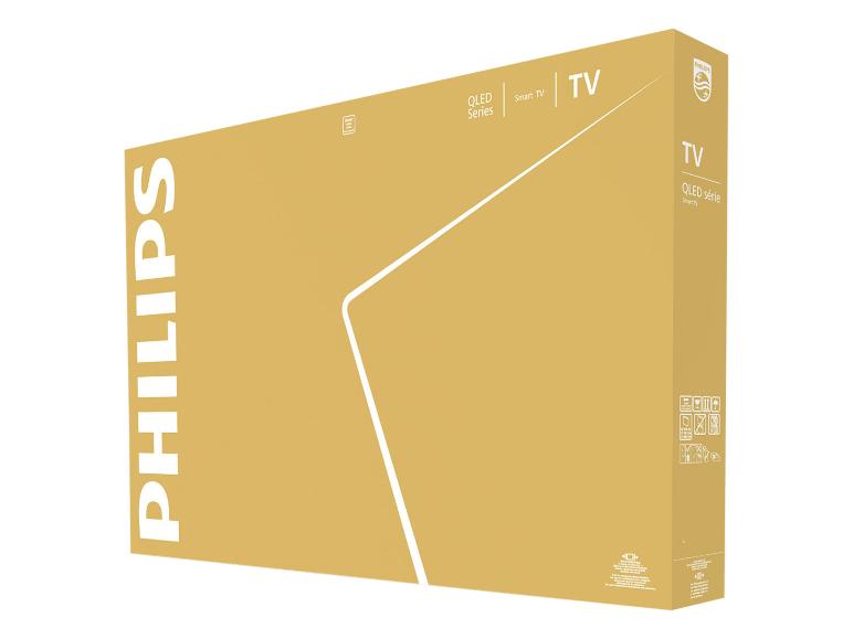 Hnědá krabice pro QLED Smart TV s detaily produktu a pokyny k manipulaci.