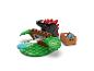 LEGO Duplo sada s černým dinosaurem, zelenými stromy a hnědou krabicí s modrými doplňky.
