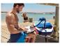 Nafukovací paddleboard a elektrická pumpa Crivit u vody.