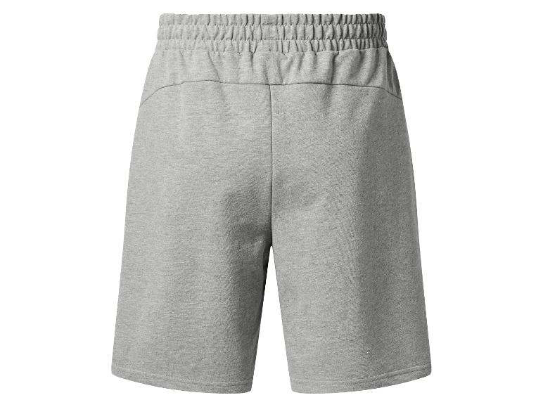 Šedé sportovní šortky s elastickým pasem, pohled zezadu.