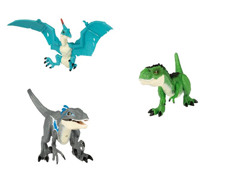 Tři hračky dinosaurů, včetně Pteranodona, Tyrannosaura Rexa a Blue.