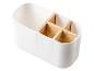 Bílý organizér na příbory s dřevěnými vložkami.