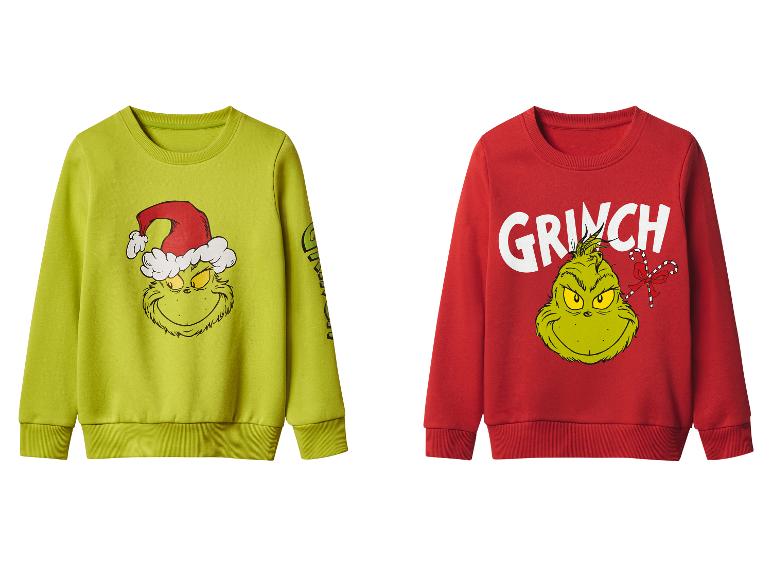 Dvě mikiny Grinch, jedna zelená a jedna červená, s vánočními potisky.