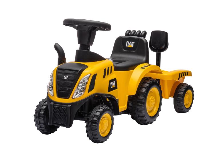 Žlutý dětský traktor s přívěsem a lopatou, s černým sedadlem a volantem.