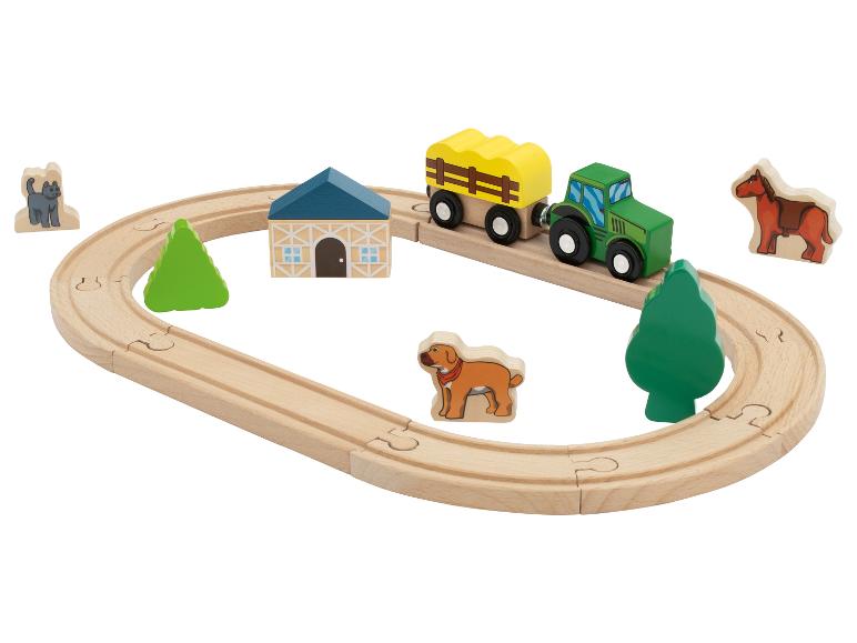 Dřevěná sada hraček s farmářskou tématikou, traktor, vagón, zvířata a kolejnice.