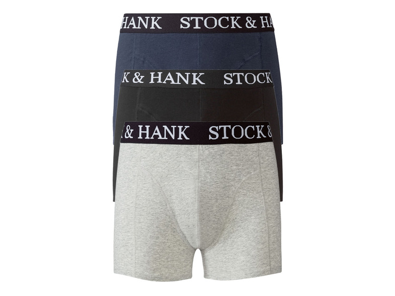 Tři páry boxerských šortek Stock & Hank v šedé, černé a tmavě modré barvě.