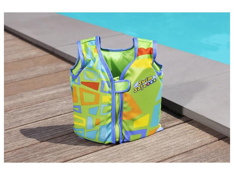 Plavací vesta SwimSafe pro děti, geometrický vzor, u bazénu.