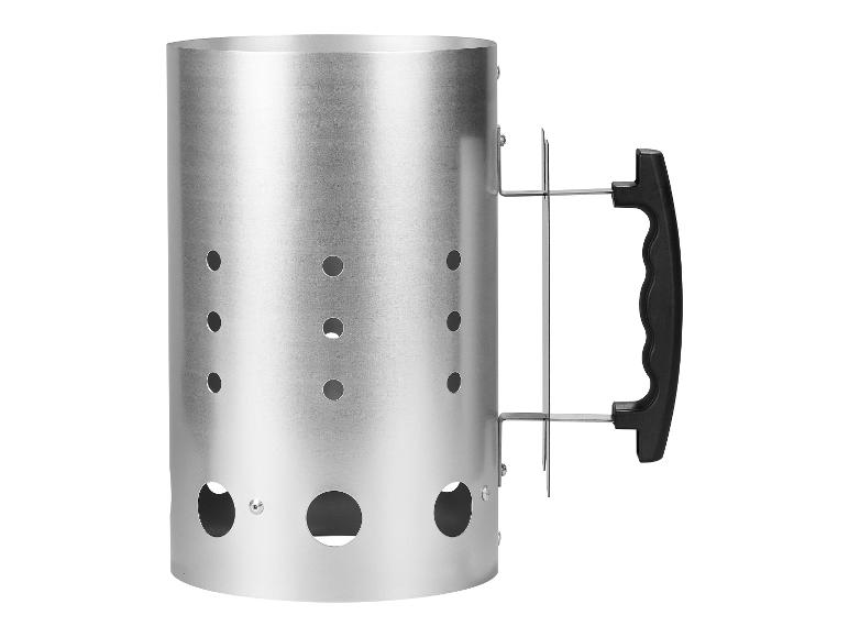 Kovový rozdělovač uhlí s černou rukojetí.