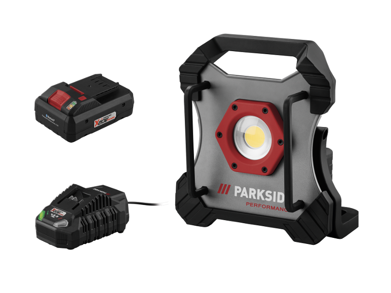 Přenosná dobíjecí LED pracovní lampa Parkside Performance se dvěma bateriemi a nabíječkou.