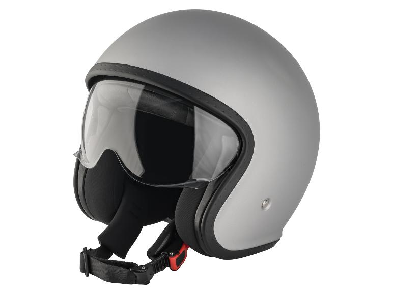Šedá motocyklová přilba s průhledným hledím a zapínáním pod bradou.