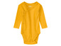 Žlutý overal s dlouhým rukávem pro miminka od Lupilu.