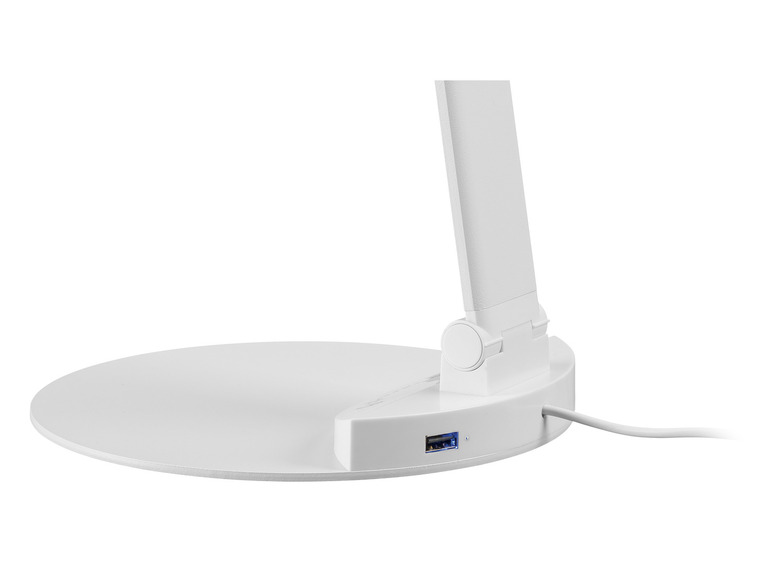 Bílá stolní lampa s kulatým podstavcem a USB portem.