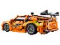 LEGO Technic Fast & Furious auto, oranžové, se zelenými detaily a spoilerem.