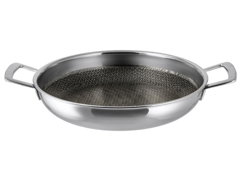 Wok pánev z nerezové oceli s dvojitou rukojetí a dnem s voštinovým vzorem.