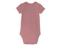 Růžový overal pro miminko s krátkými rukávy.