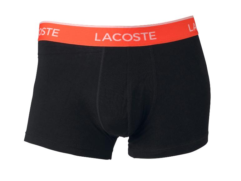 Černé boxerky Lacoste s oranžovým pruhem.