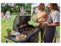 Venkovní grilování: hamburgery, zelenina a grilované pokrmy na grilu Grillmaster.