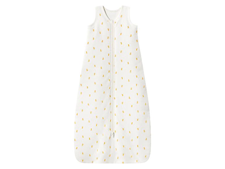 Bílý dětský spací pytel s malými žlutými kachními vzory a předním zipem